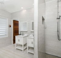 Bathers across the bay from Port Douglas - Maitland Accommodation